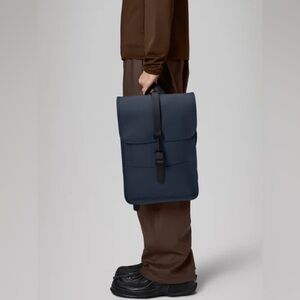 Brand new Rains navy backpack mini, 100% waterproof.